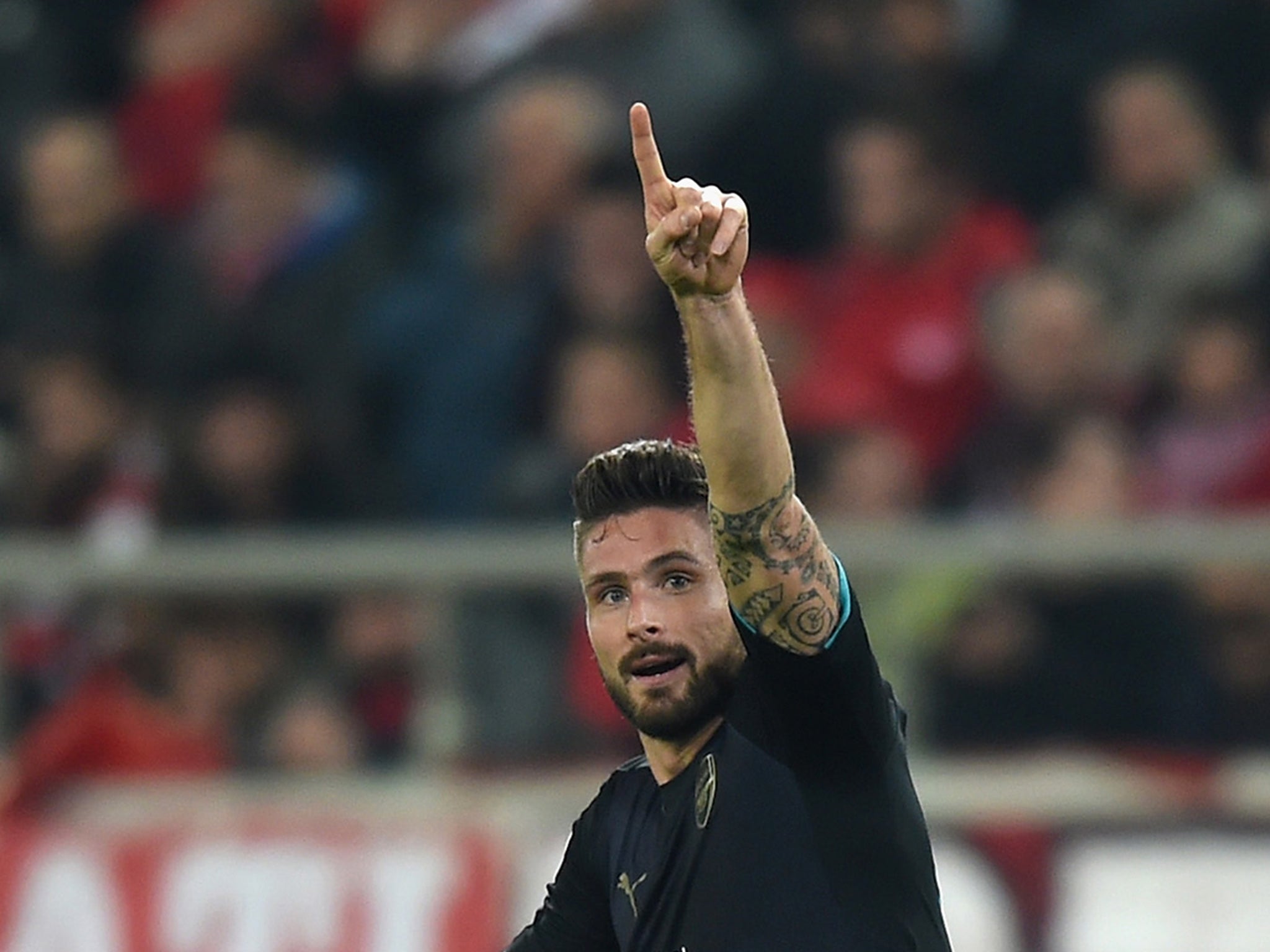 Olivier Giroud celebrates the second of his hat-trick on Wednesday night