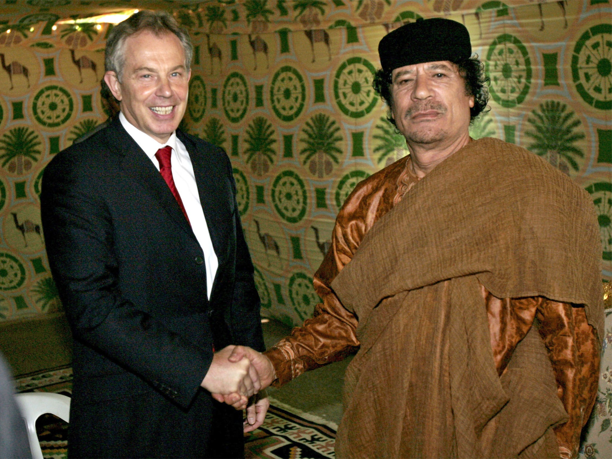 Former Prime Minister Tony Blair meets Muammar Gaddafi at the former Libyan leader’s desert base outside Sirte in May 2007