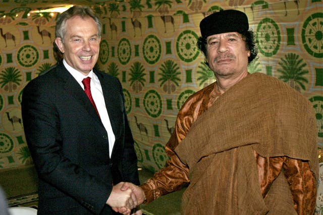 Former Prime Minister Tony Blair meets Muammar Gaddafi at the former Libyan leader’s desert base outside Sirte in May 2007