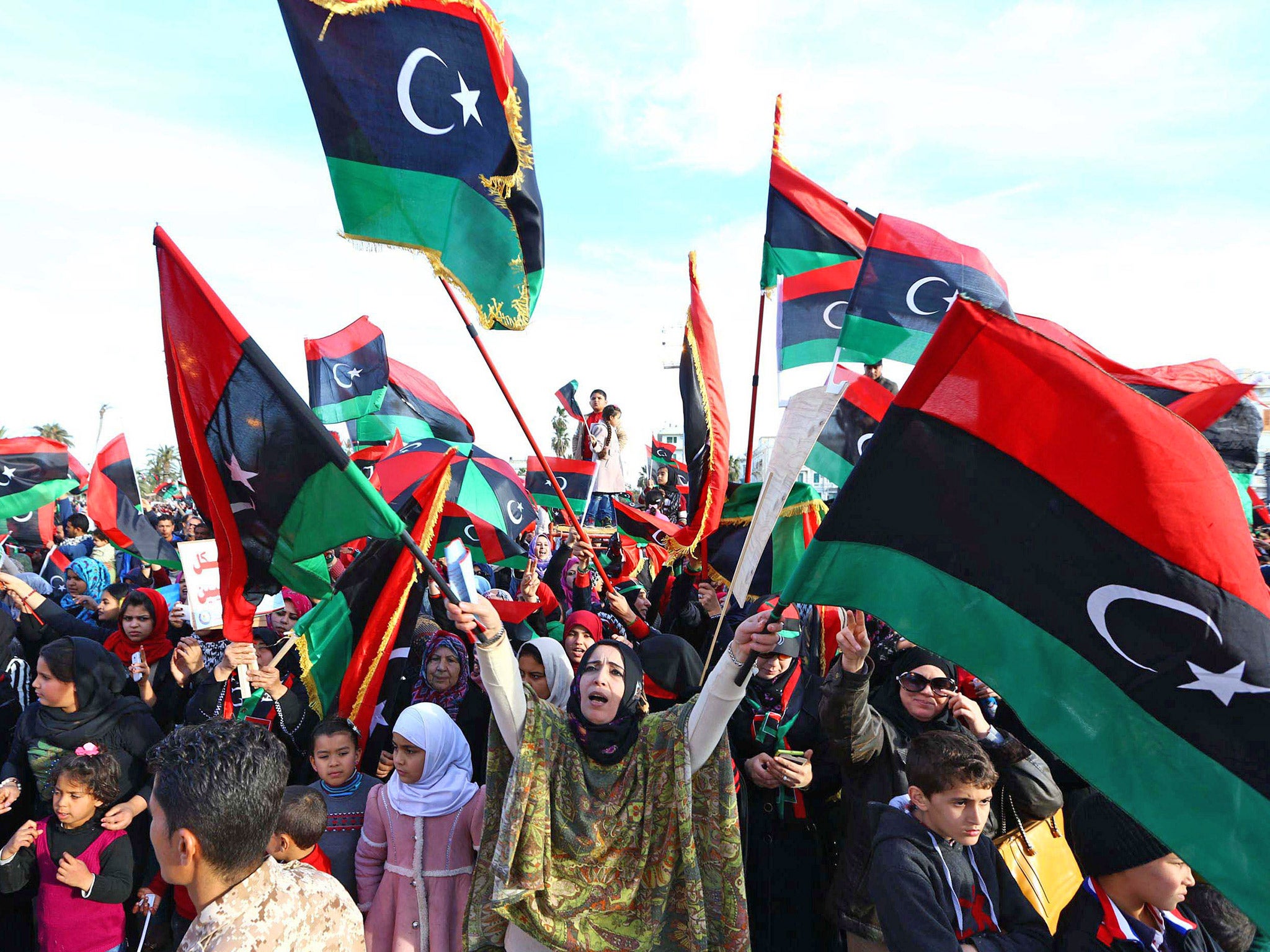 Libyans celebrate in the fourth anniversary of the revolution, in Tripoli, earlier this year (Getty)