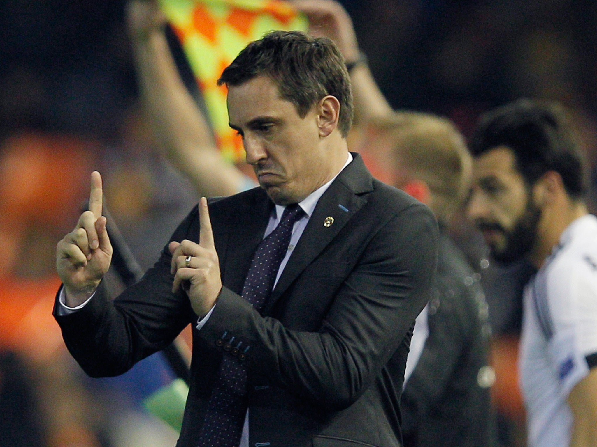 Gary Neville reacts on the touchline