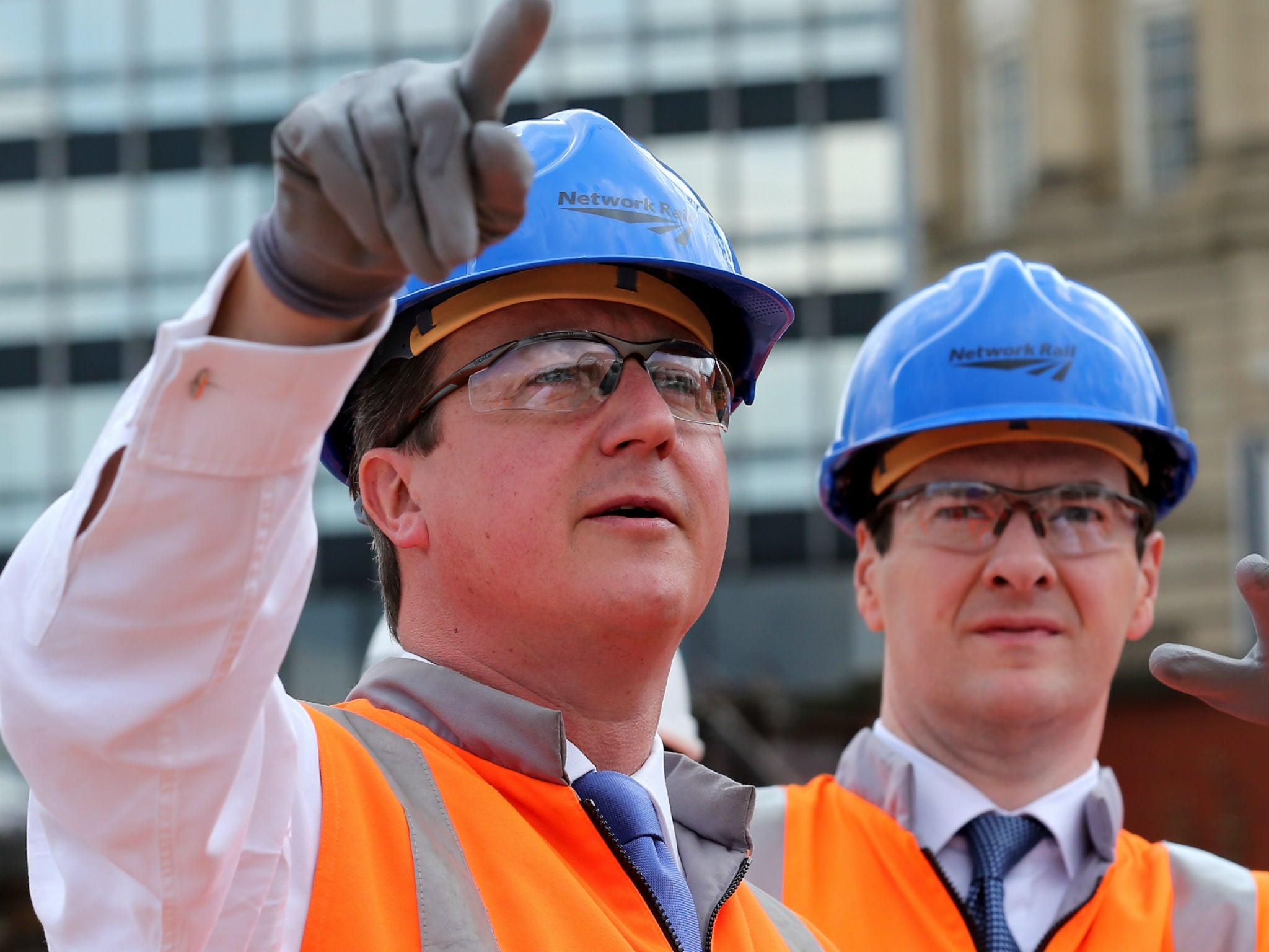 David Cameron and George Osborne visit Victoria station in Manchester in 2014
