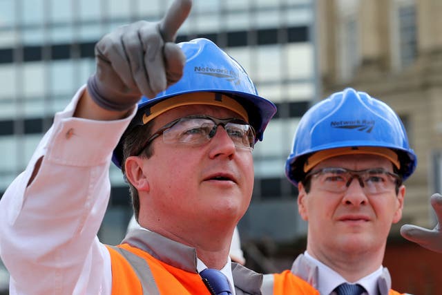 David Cameron and George Osborne visit Victoria station in Manchester in 2014