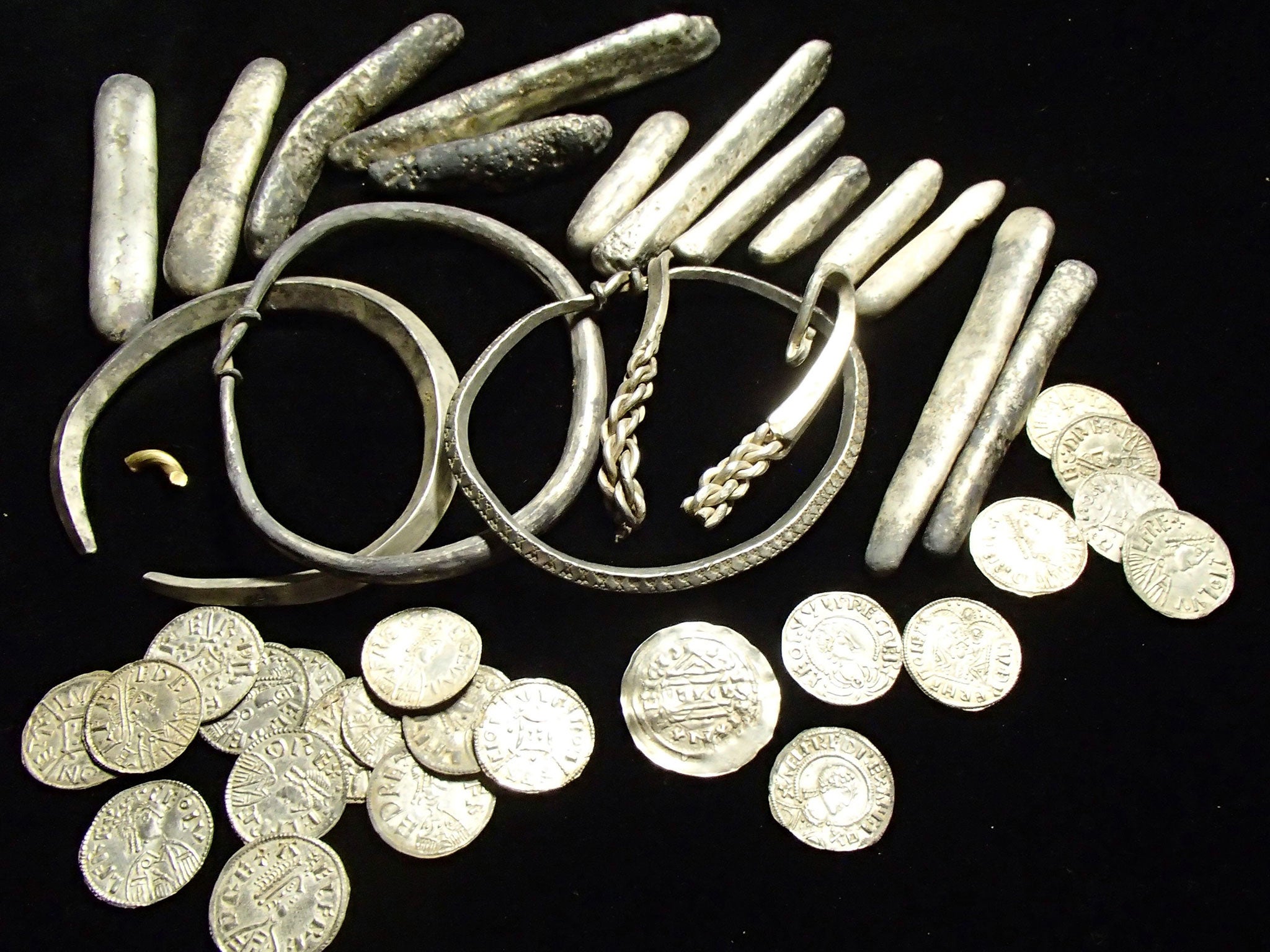Dozens of rare coins, Viking arm rings and silver inglots were among a "nationally significant" hoard discovered in Oxfordshire