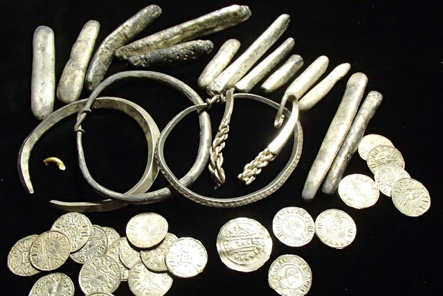 Dozens of rare coins, Viking arm rings and silver inglots were among a "nationally significant" hoard discovered in Oxfordshire