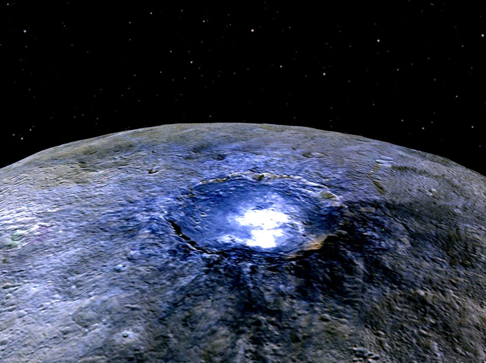 This representation of Ceres' Occator Crater in false colours shows differences in the surface composition. Scientists use the false colour as a way of examining the way that the surface is composed