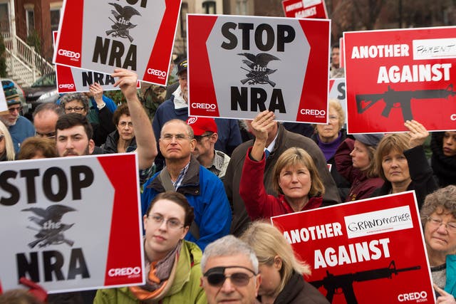 A protest in reaction to the shooting at Sandy Hook Elementary School in December 2012. State law currently bans guns from college campuses, but that will change in 2016