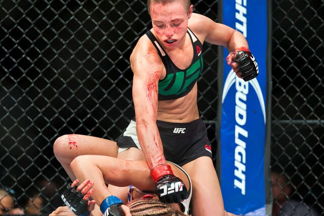 Rose Namajunas unleashes a flurry of punches on Paige VanZant