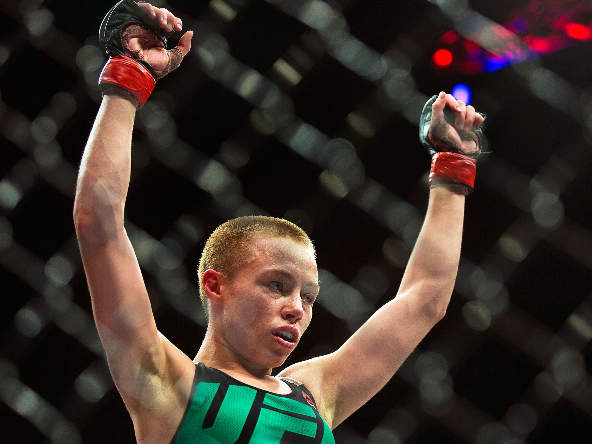 Rose Namajunas raises her arms in victory over Paige VanZant