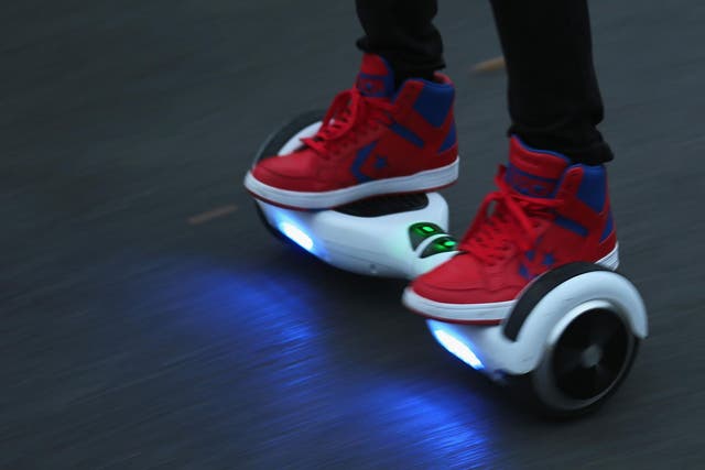 A person riding a hoverboard