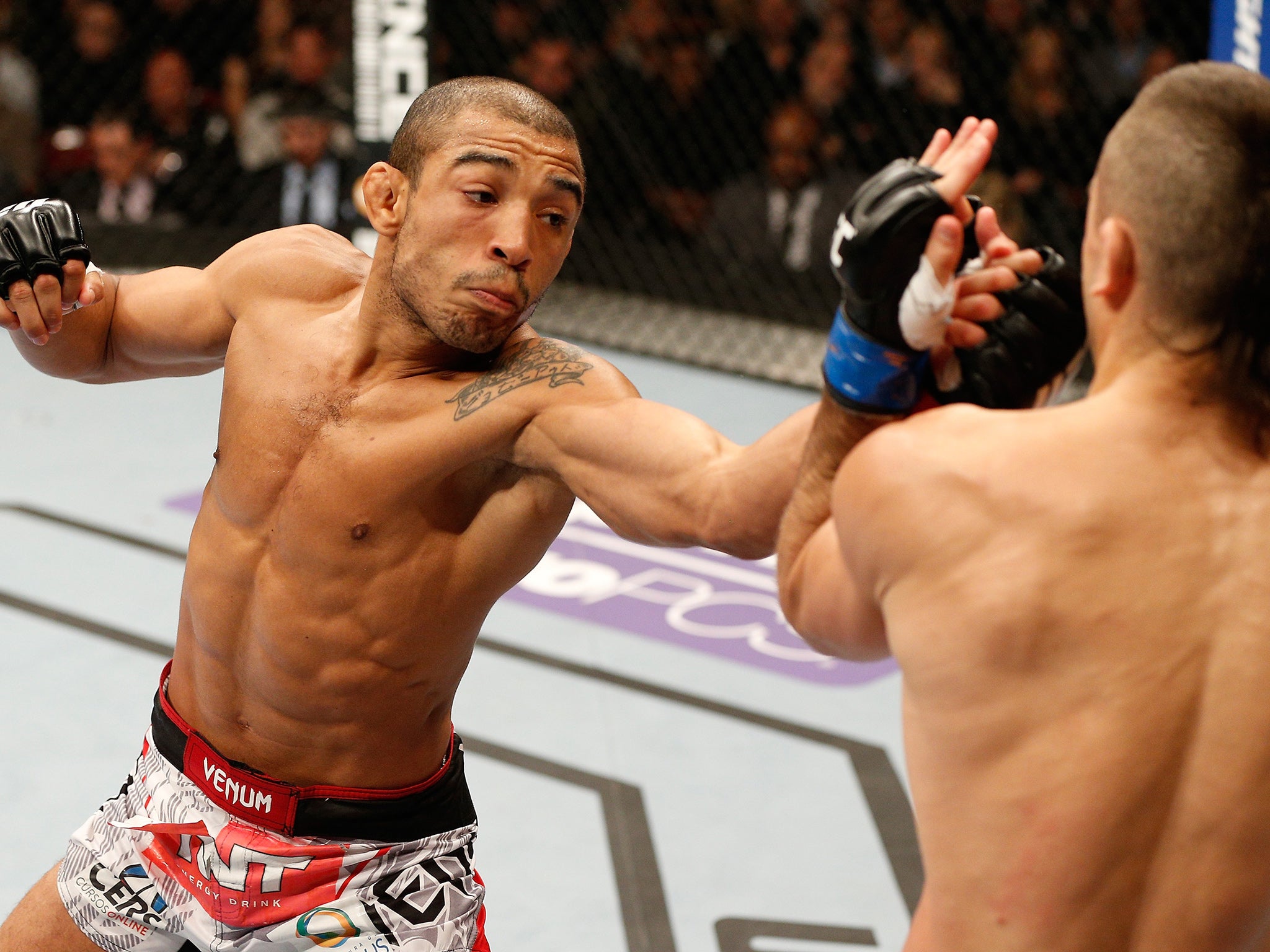 Featherweight champion Jose Aldo (left) in action