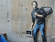 Banksy paints Apple founder Steve Jobs on wall in Calais jungle