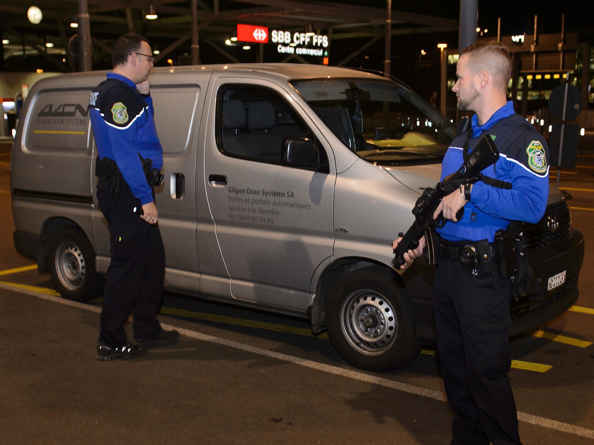 Security officers check a van at Geneva's airport on 10 December, 2015, after police raised the alert level and searched the city for several suspected jihadists believed to have links to Isis