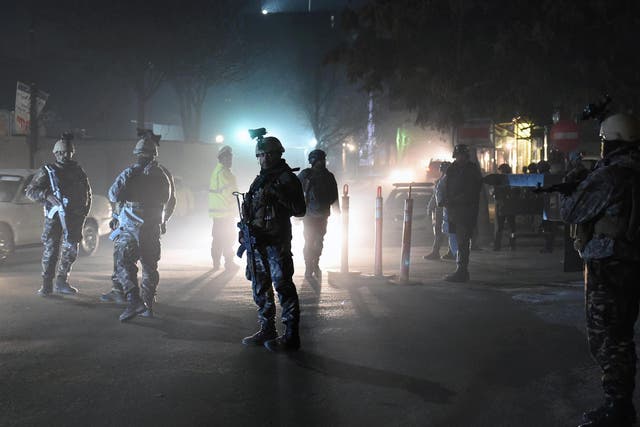 Afghan police outside the Spanish embassy attacked by Taliban fighters on Friday night