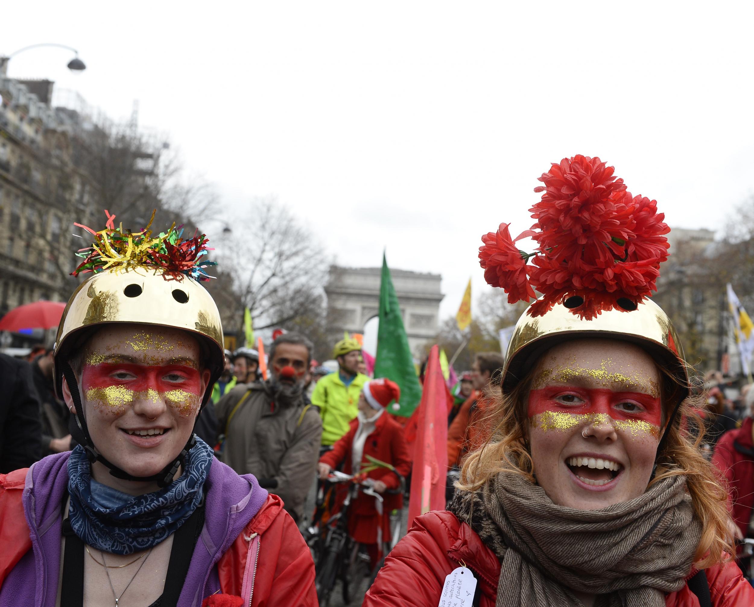 Environmental activists in Paris celebrating the potential deal outside the Arc de Triomphe