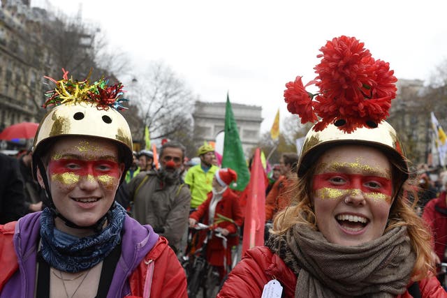 Environmental activists in Paris celebrating the potential deal outside the Arc de Triomphe