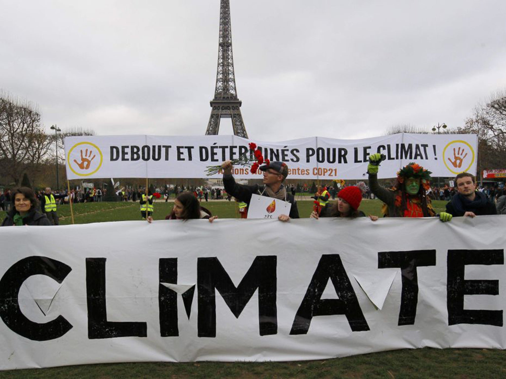 Environmentalists attend a demonstration near the Eiffel Tower in Paris, France, during the World Climate Change Conference 2015