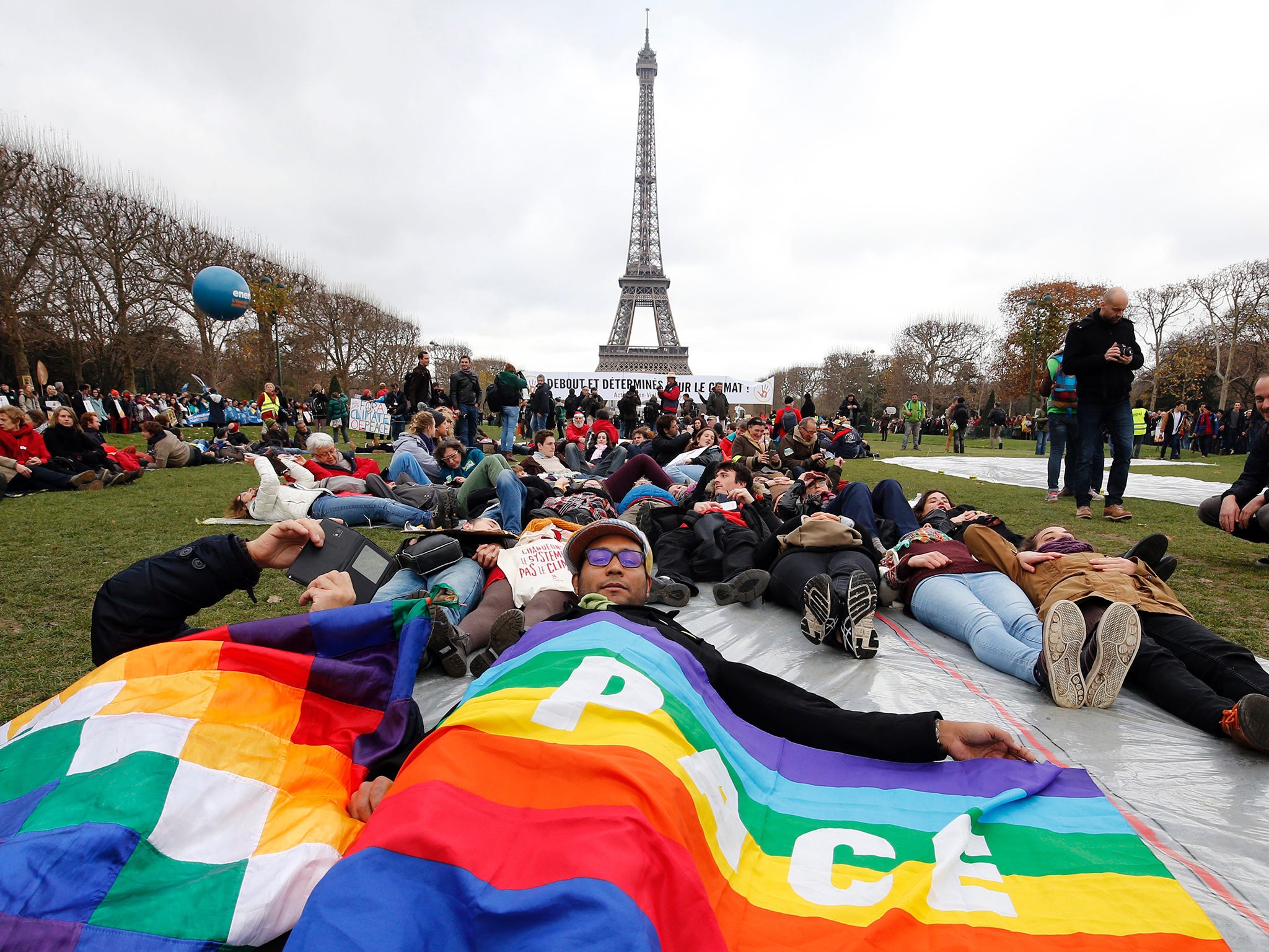 Demonstrators form a human chain on the Champs de Mars during the Paris climate summit