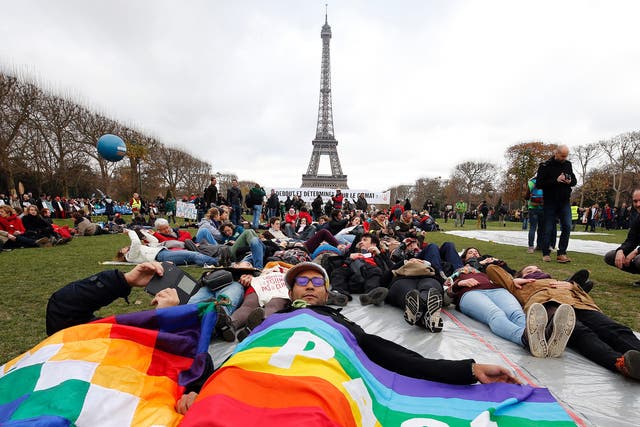 Demonstrators form a human chain on the Champs de Mars during the Paris climate summit