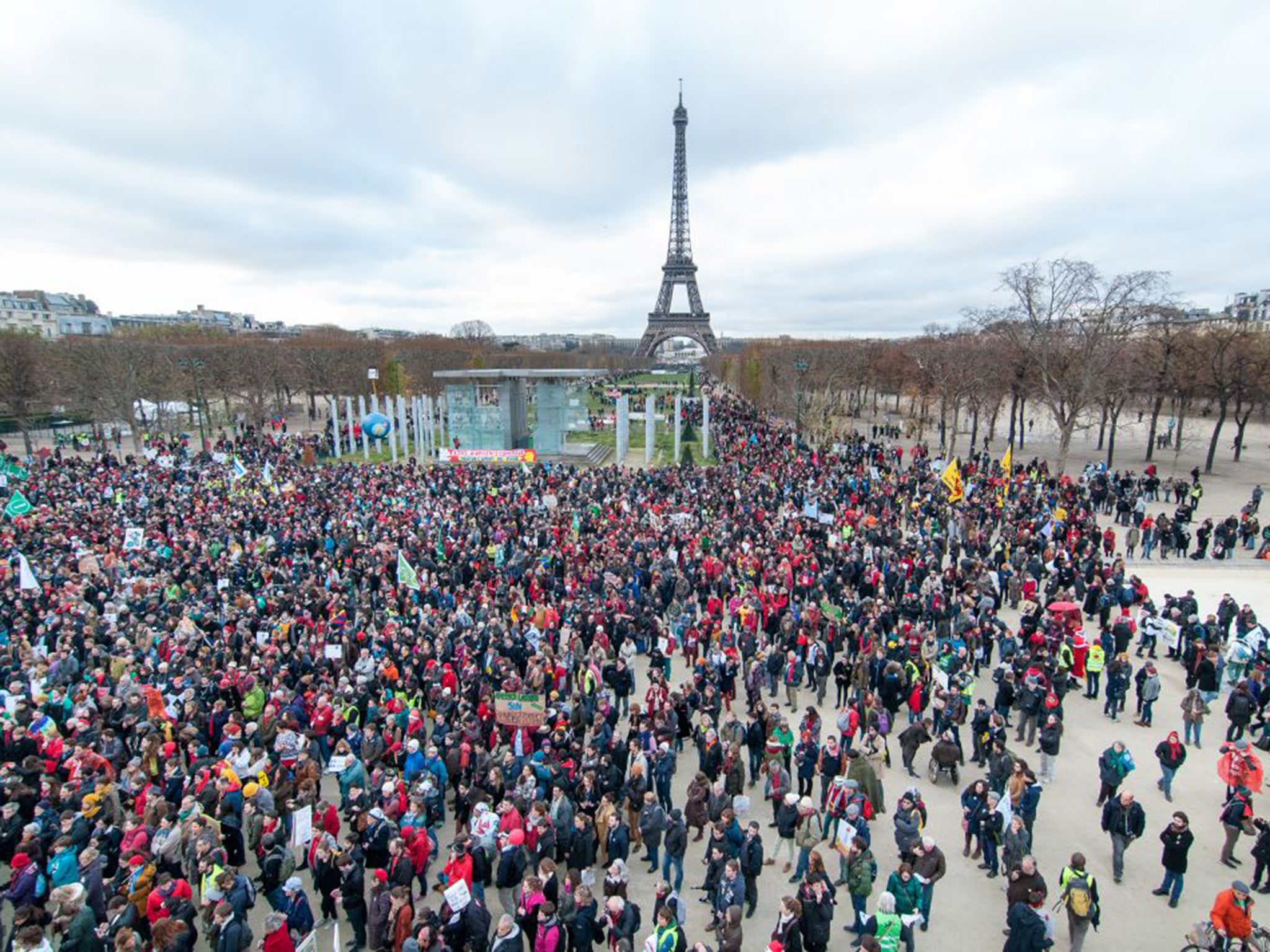 Thousands gather on Champ de Mars near the Eiffel tower for a human chain as COP 21 negotiations come to an end