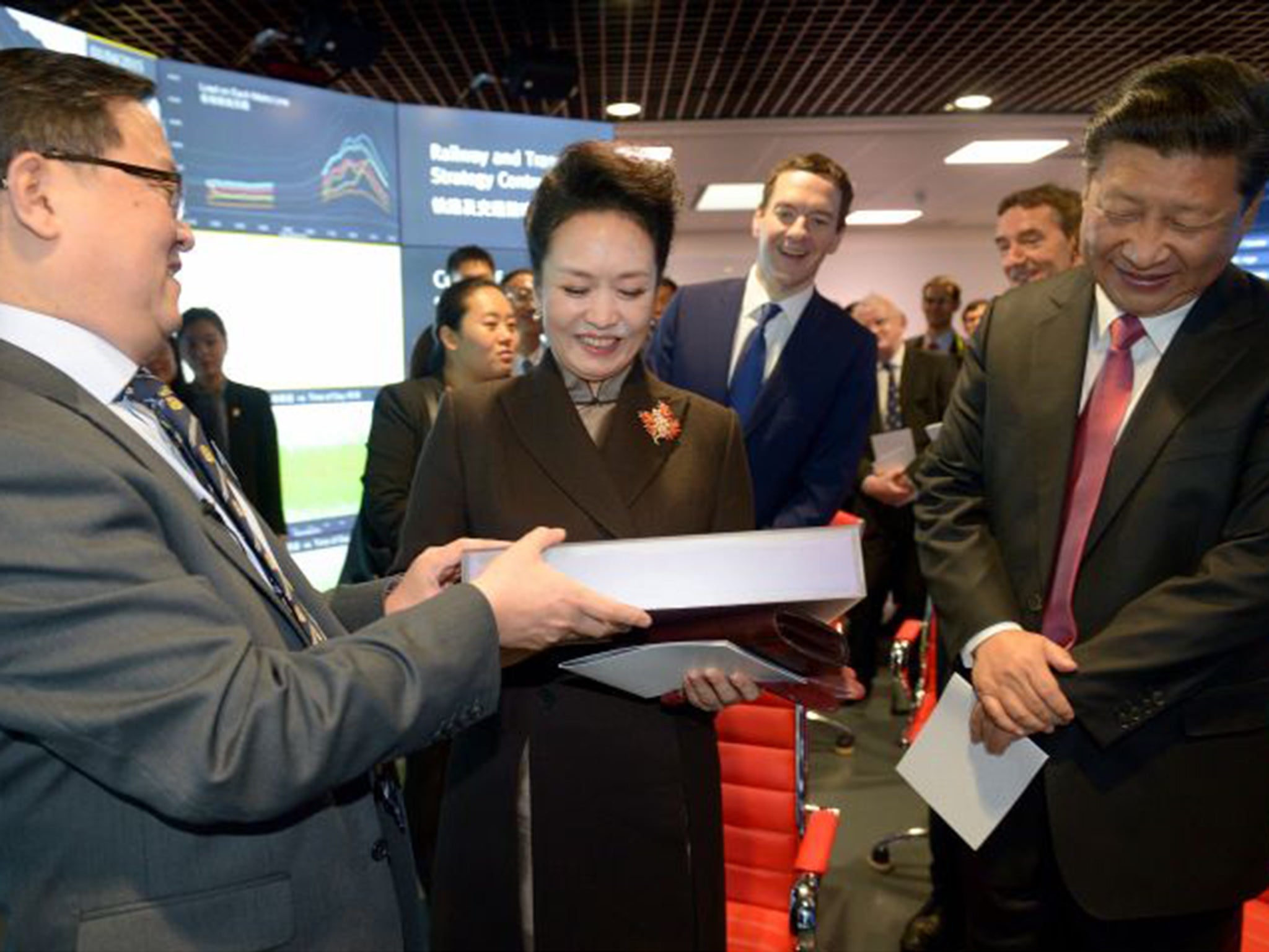 Chinese President Xi Jinping is presented a gift during his visit to Imperial College London in October