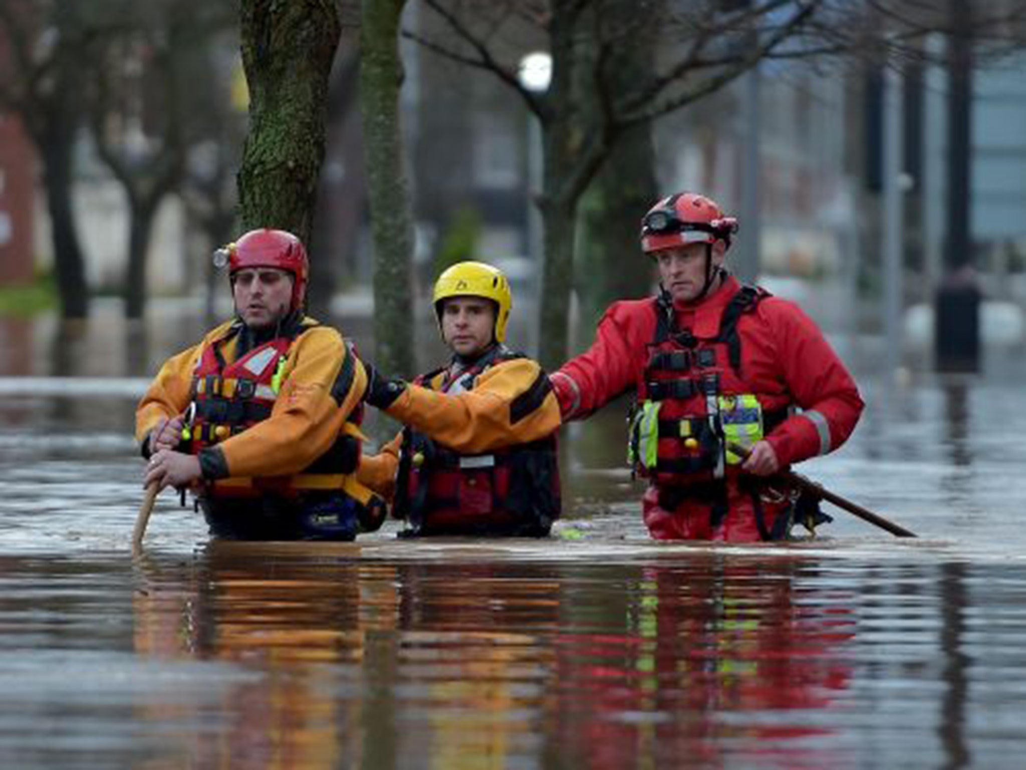 In Cumbria, torrents have overwhelmed homes and shops, mangled cars and killed three people over the past week (Getty)