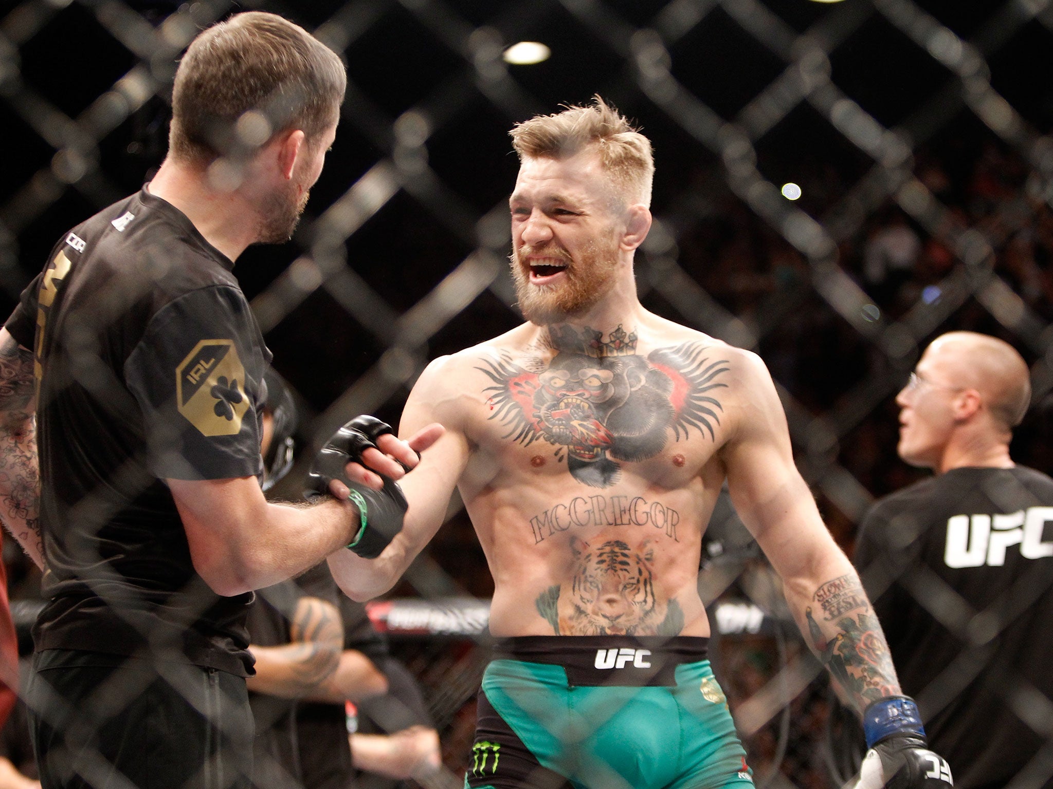 Conor McGregor celebrates victory over Jose Aldo