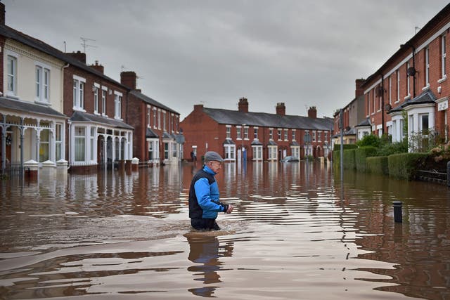 Flooding, like these scenes from northern England, will get worse under the government's environment and climate policies.