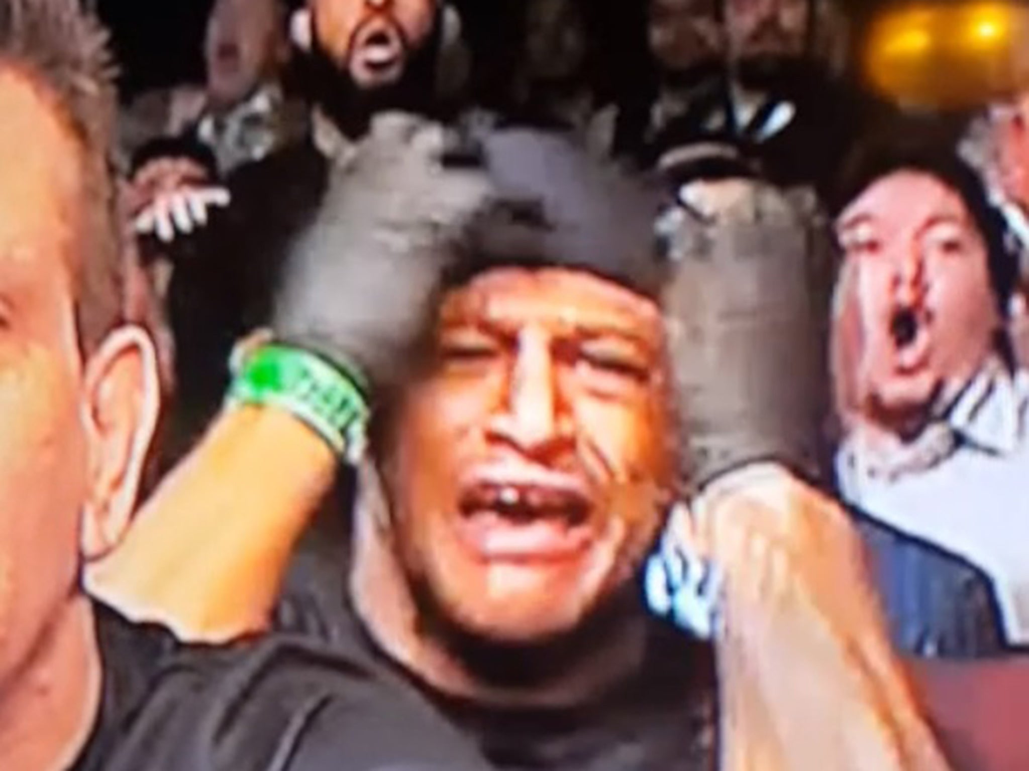 Jose Aldo's cornerman watches his fighter get knocked out