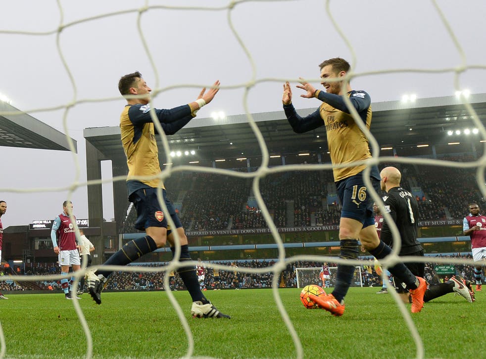 Aaron Ramsey and Mesut Ozil celebrate Arsenal's second goal against Aston Villa