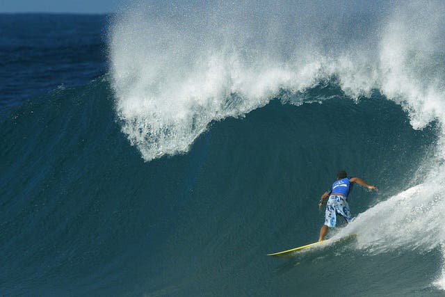 A surfer pictured at Banzai Pipeline