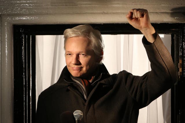 Julian Assange speaks from the balcony of the Ecuadorian Embassy in London in December 2012
