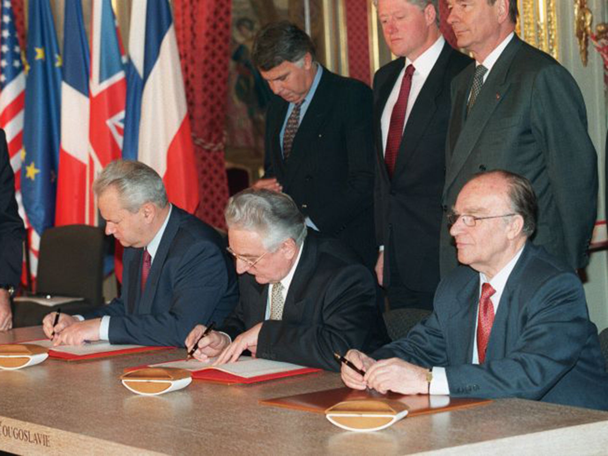 Slobodan Milosevic, Alija Izetbegovic and Franjo Tudjman sign the Dayton peace accord in Paris in 1995