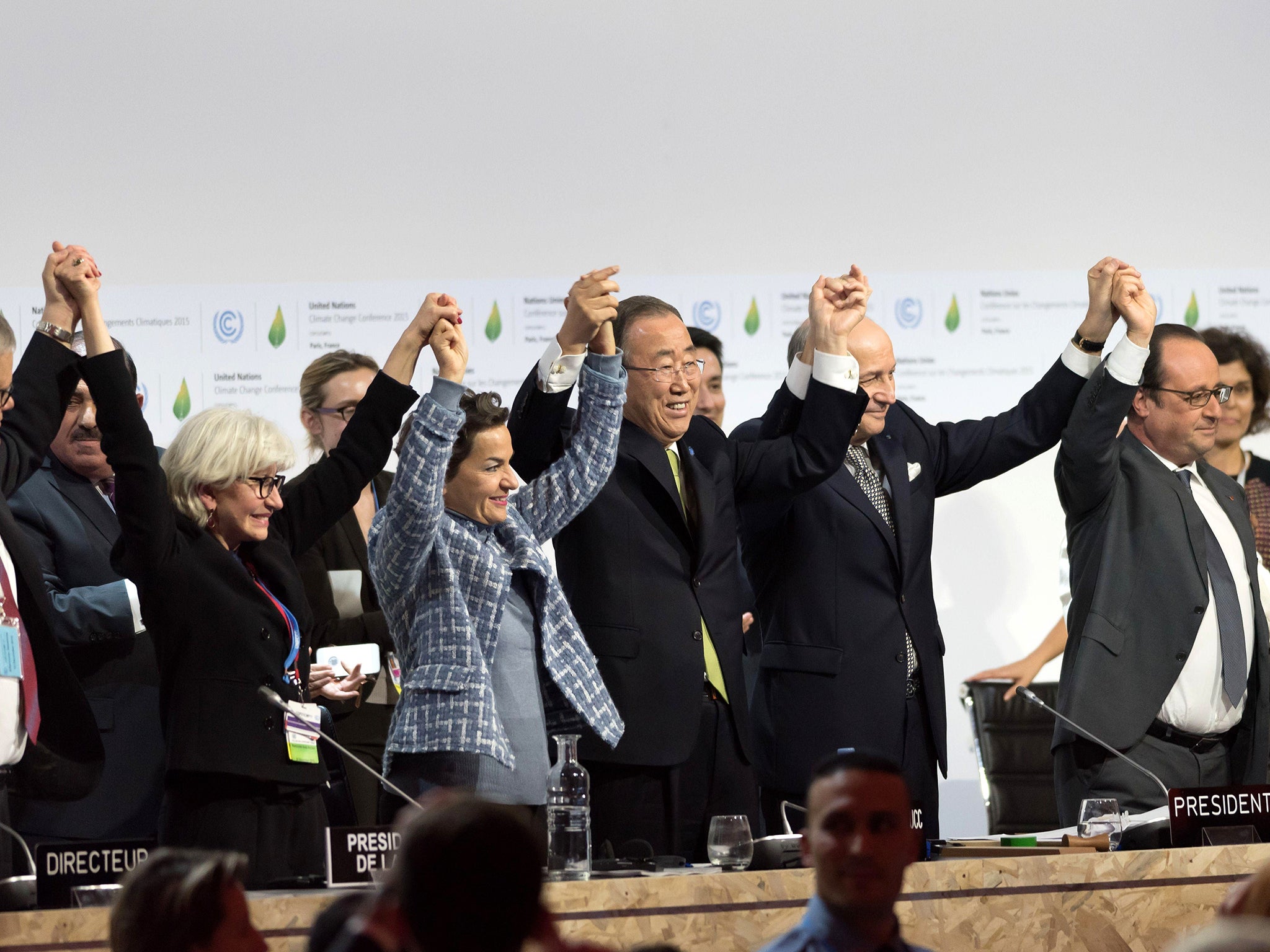Politicians and officials who negotiated the Paris Agreement on climate change jumped for joy and clapped each other on the back after the deal was done