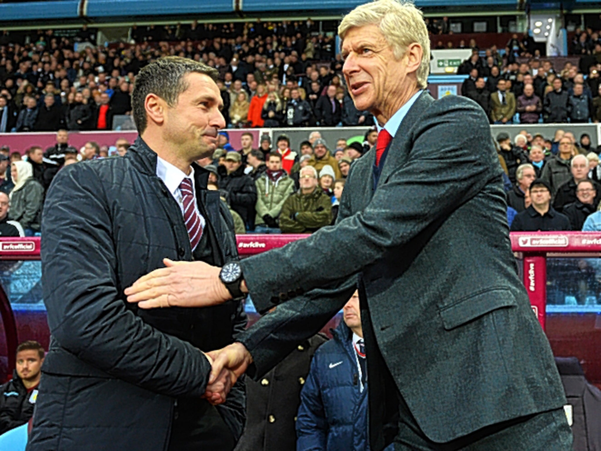 Arsène Wenger (right) shakes hands with his Aston Villa counterpart Rémi Garde before the game