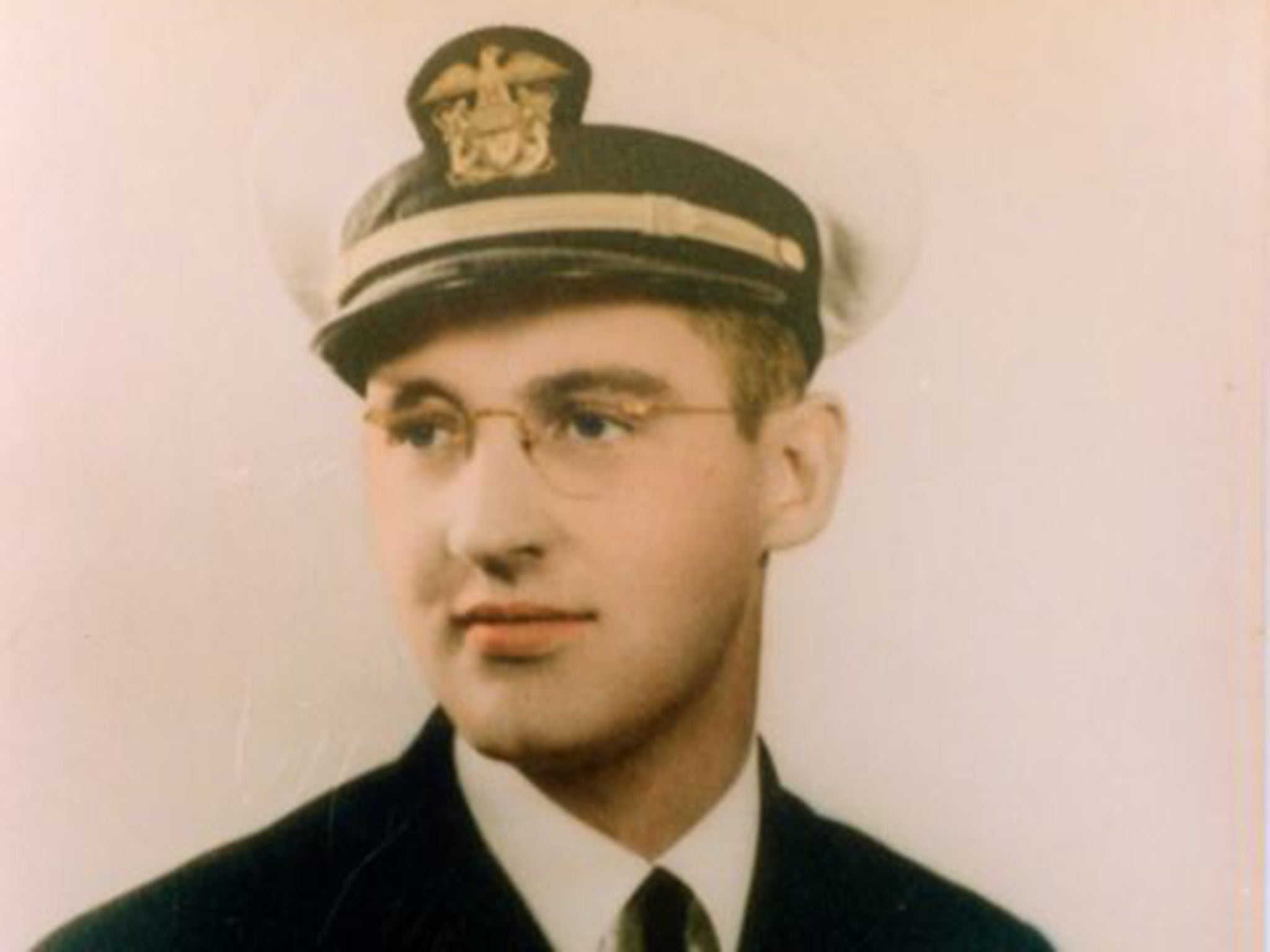 Aloysius Schmitt, the chaplain, helped other sailors escape the sinking ship through port holes