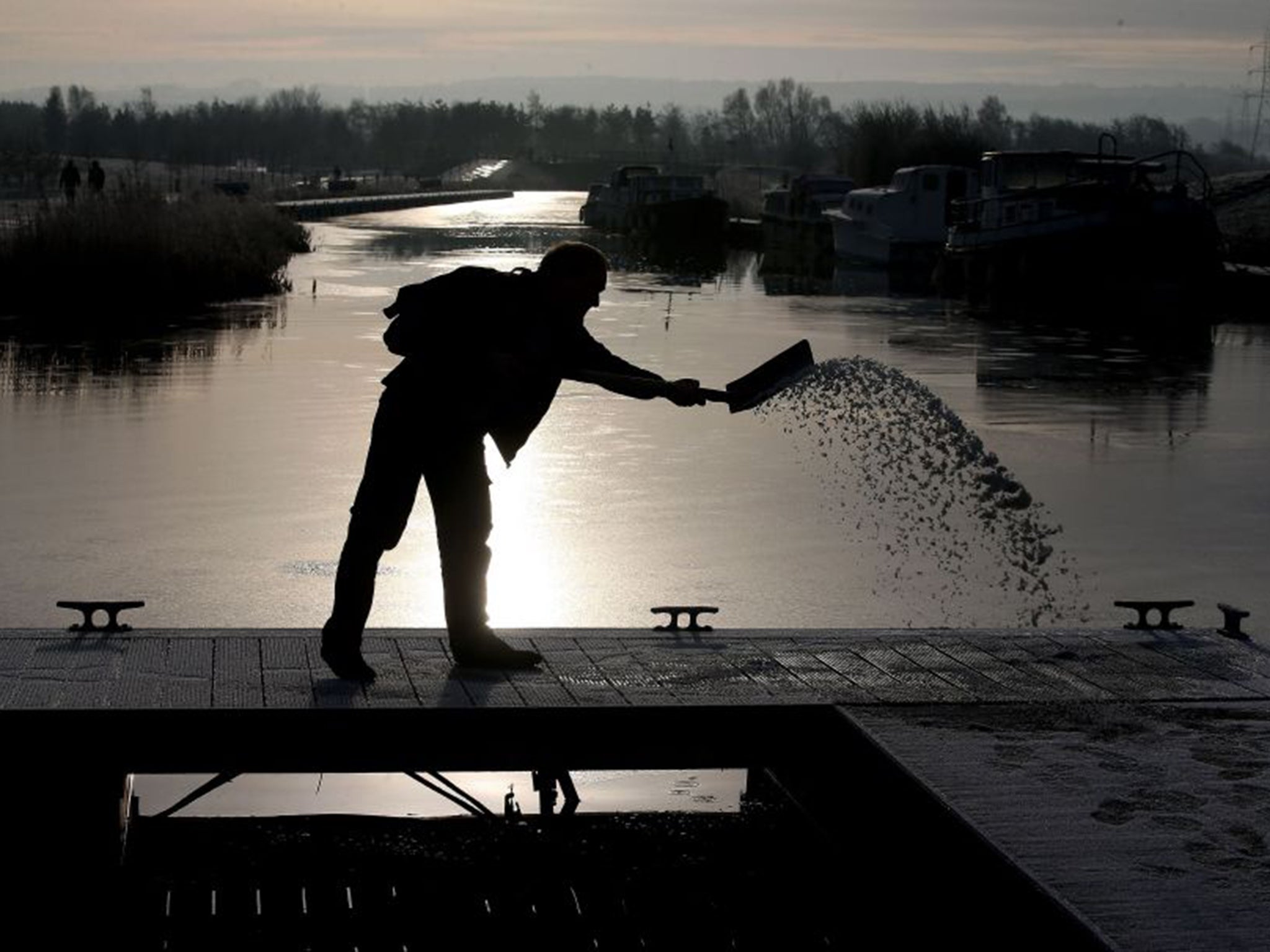 Spreading grit after a heavy frost on the Forth and Clyde canal