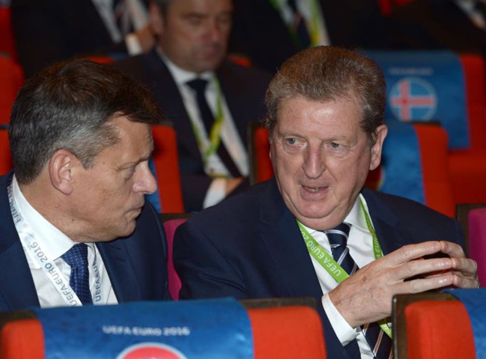 Roy Hodgson, right, speaks with the FA chief executive, Martin Glenn, during the Euro 2016 draw in Paris on Saturday