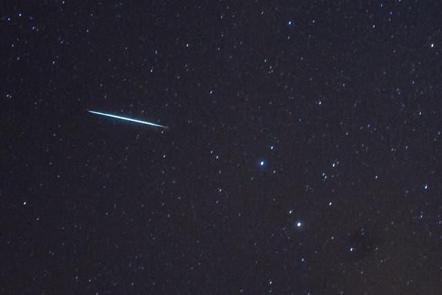 A Geminid meteor enters the Earth's atmosphere above New York
