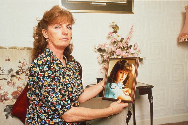 Marie McCourt, pictured, with a photo of her daughter, Helen, who disappeared in 1988 at the age of 22