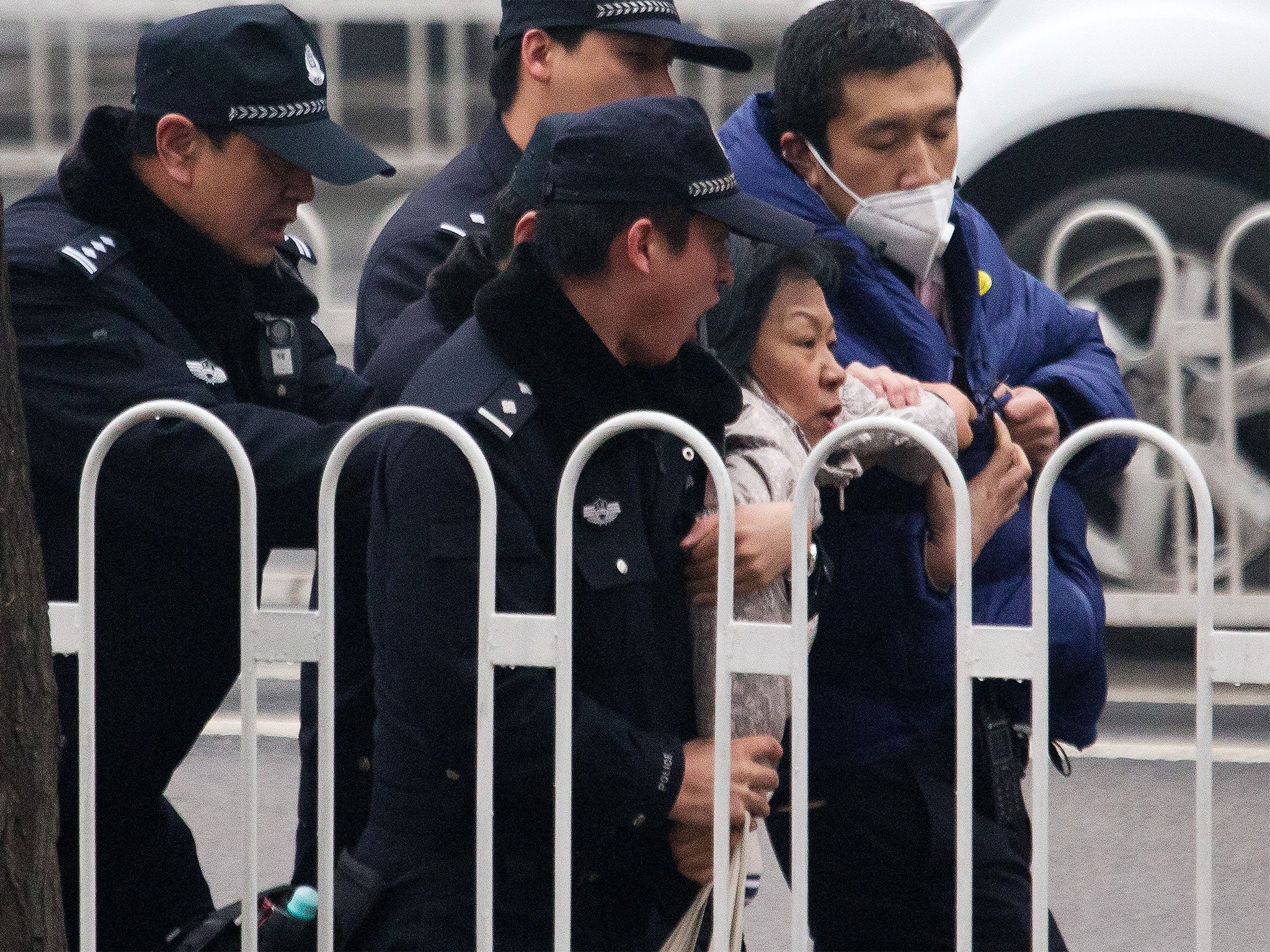 Scuffles outside Beijing court as human rights lawyer Pu Zhiqiang goes on trial
