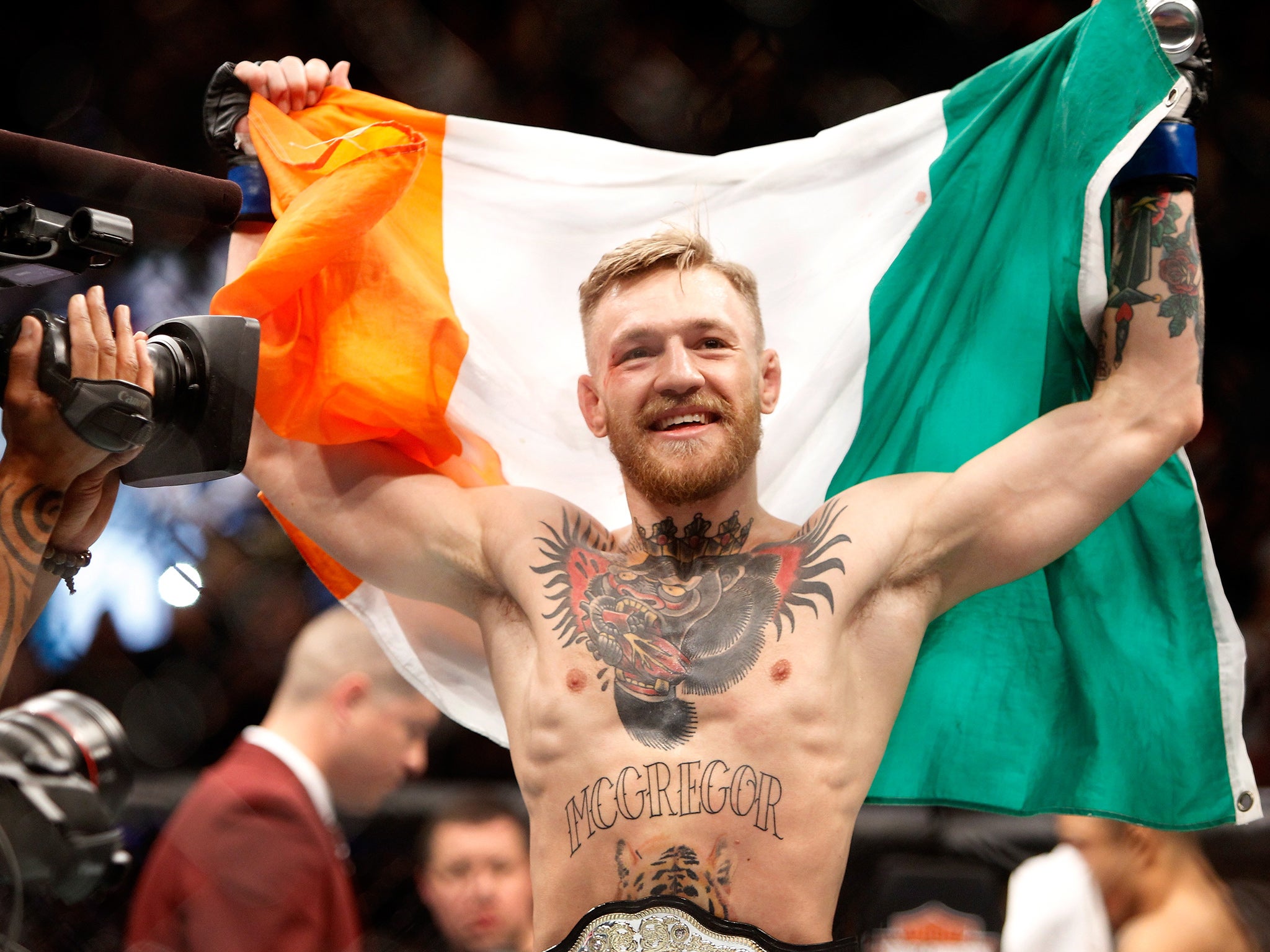 Conor McGregor celebrates his victory over Jose Aldo