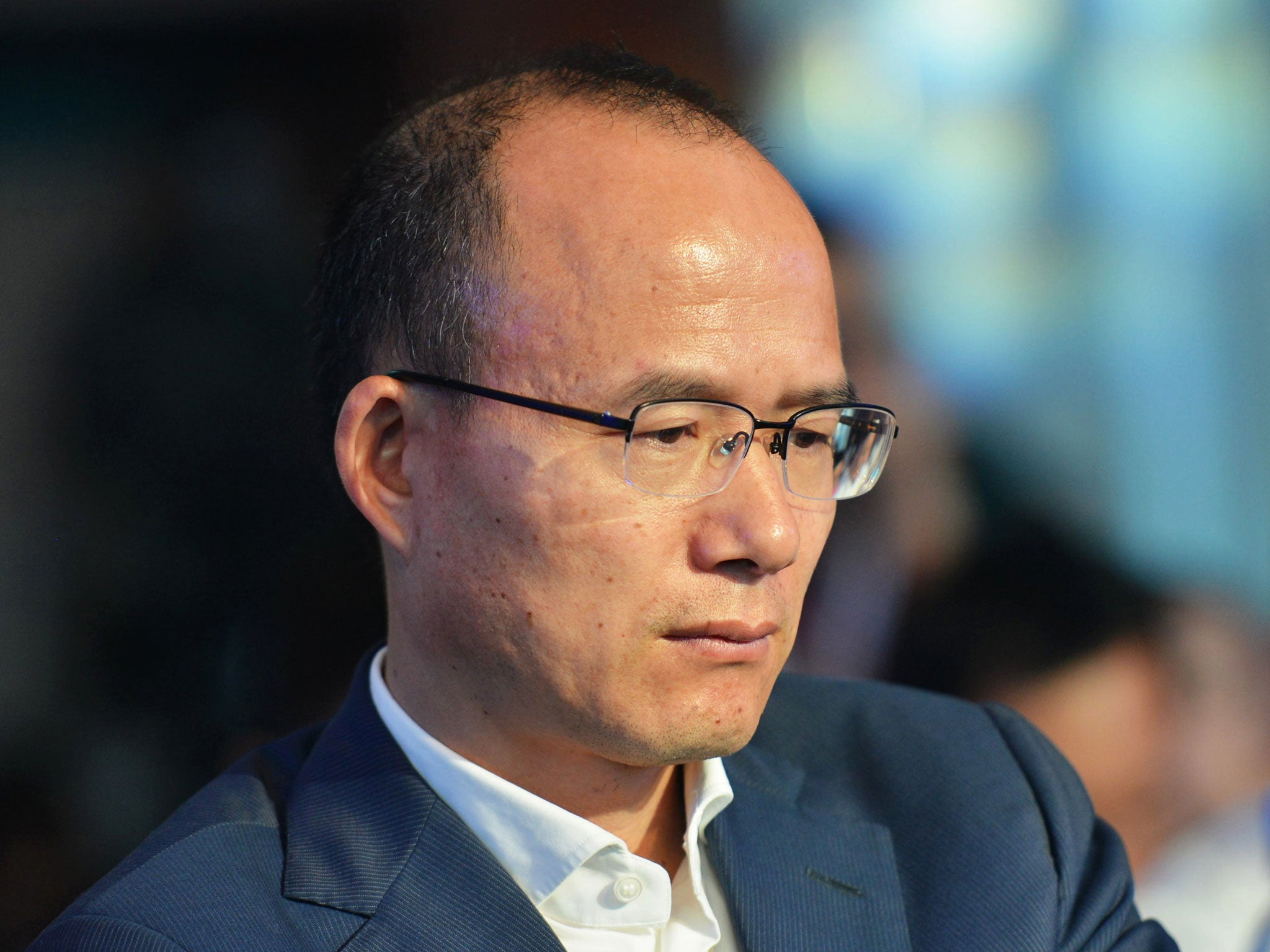 This photo taken on June 25, 2015 shows Guo Guangchang, the chairman of one of China's biggest private-sector conglomerates, Club Med owner Fosun, attending a conference in Hangzhou, in eastern China's Zhejiang province. Fosun said on December 11, 2015 its chairman Guo Guangchang was cooperating with judicial authorities over a reported corruption investigation