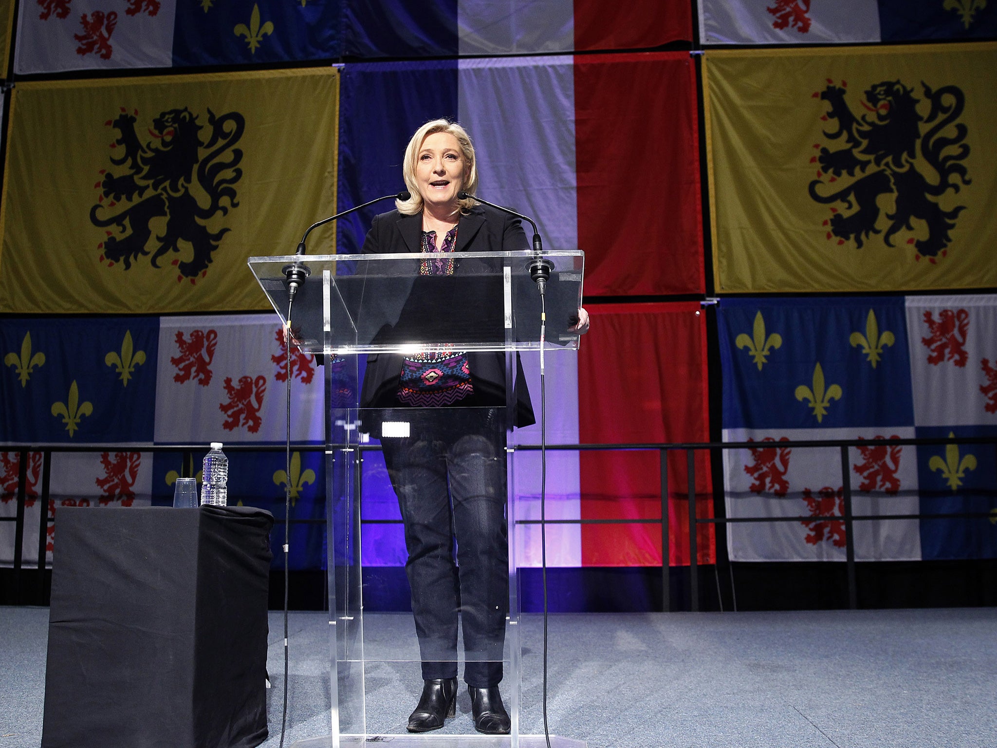French far-right Front National (FN) party's President Marine Le Pen makes a statement after the results of the second round of the regional elections at Francois Mitterrand hall