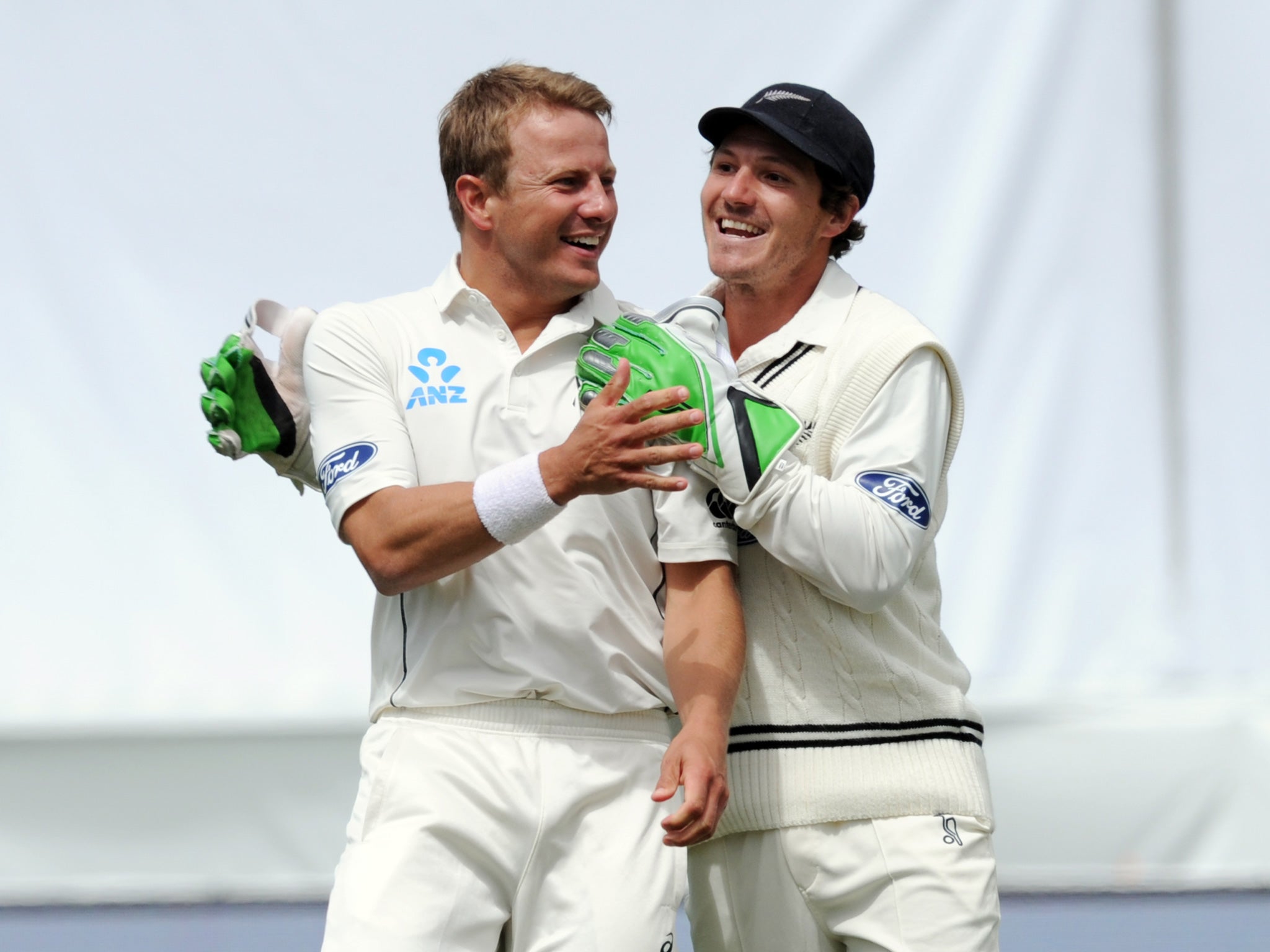 New Zealand's Neil Wagner, left, celebrates with BJ Watling after bowling out Sri Lankaís Angelo Mathews for 25, on day five of the first International Cricket Test in Dunedin, New Zealand