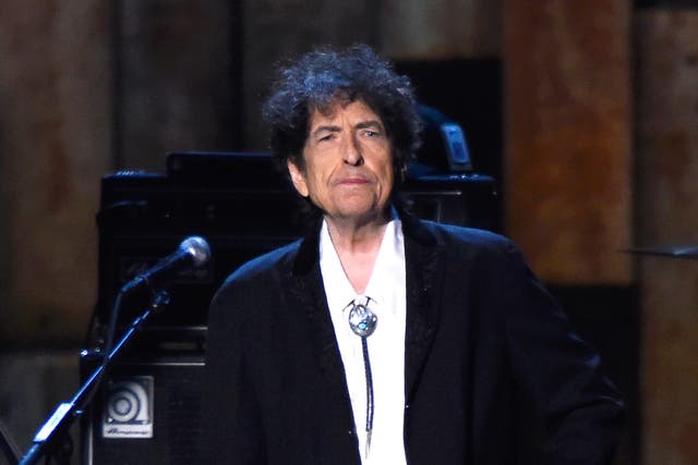 <p>Bob Dylan appears onstage at the 25th anniversary MusiCares 2015 Person Of The Year Gala</p>