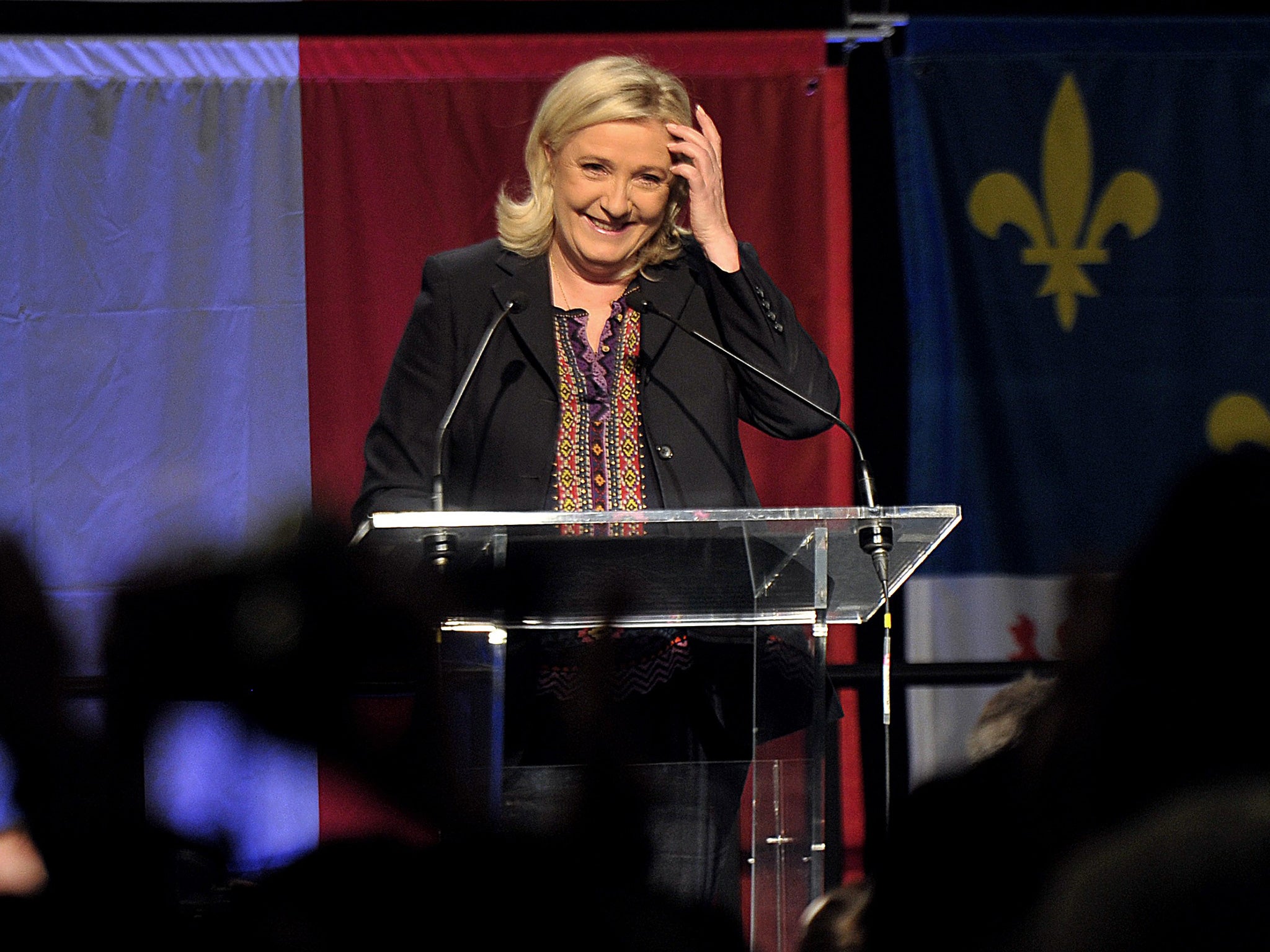 French far-right National Front (FN) leader Marine Le Pen arrives to deliver a speech following the announcement of results in the second round of French regional elections