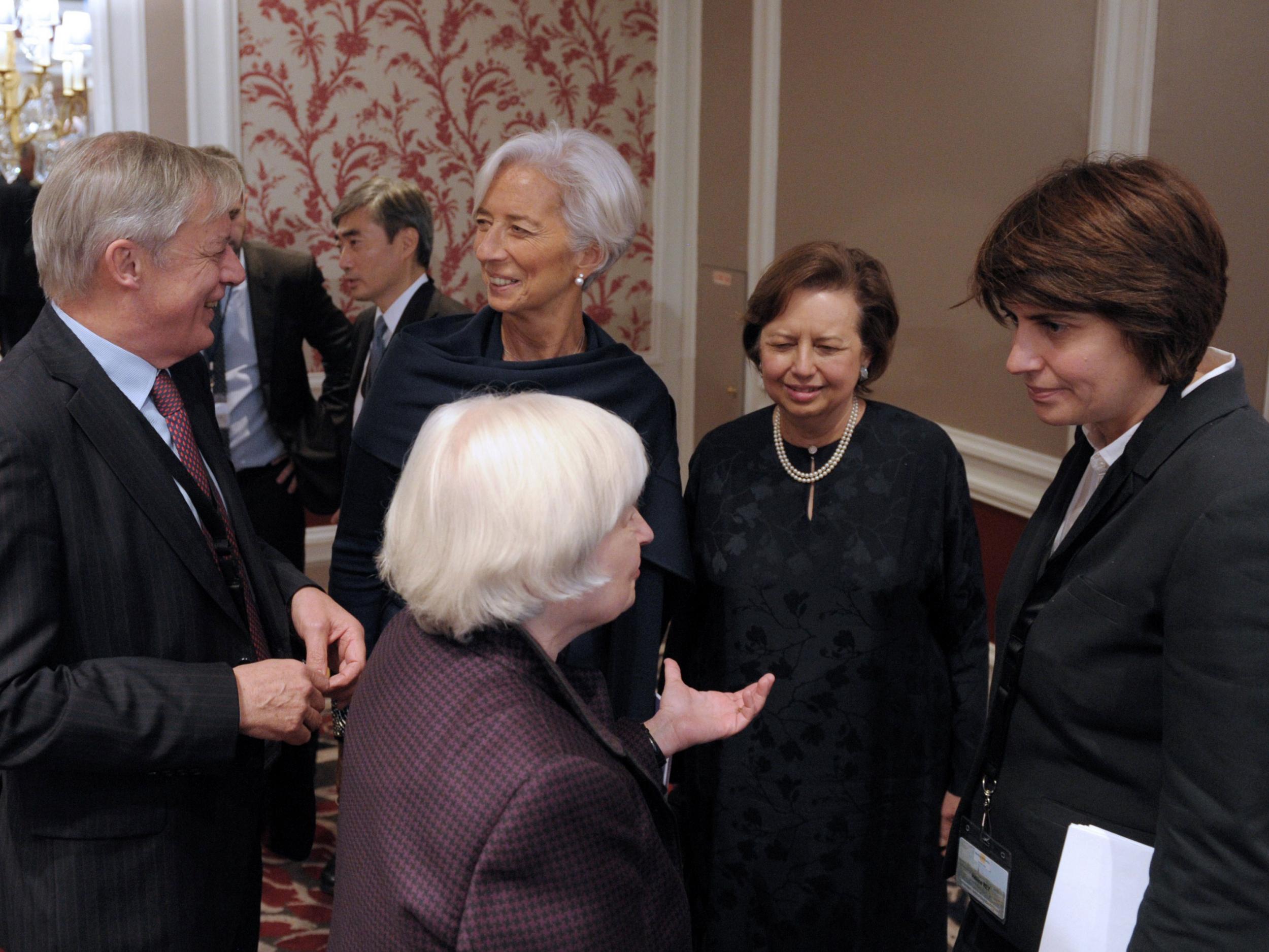 Bank de France Governor Christian Noyer talks with International Monetary Fund (IMF) Managing Director Christine Lagarde as US Federal Reserve Chair Janet Yellen (front) talks with Helene Rey, Professor of Economics at London Business School