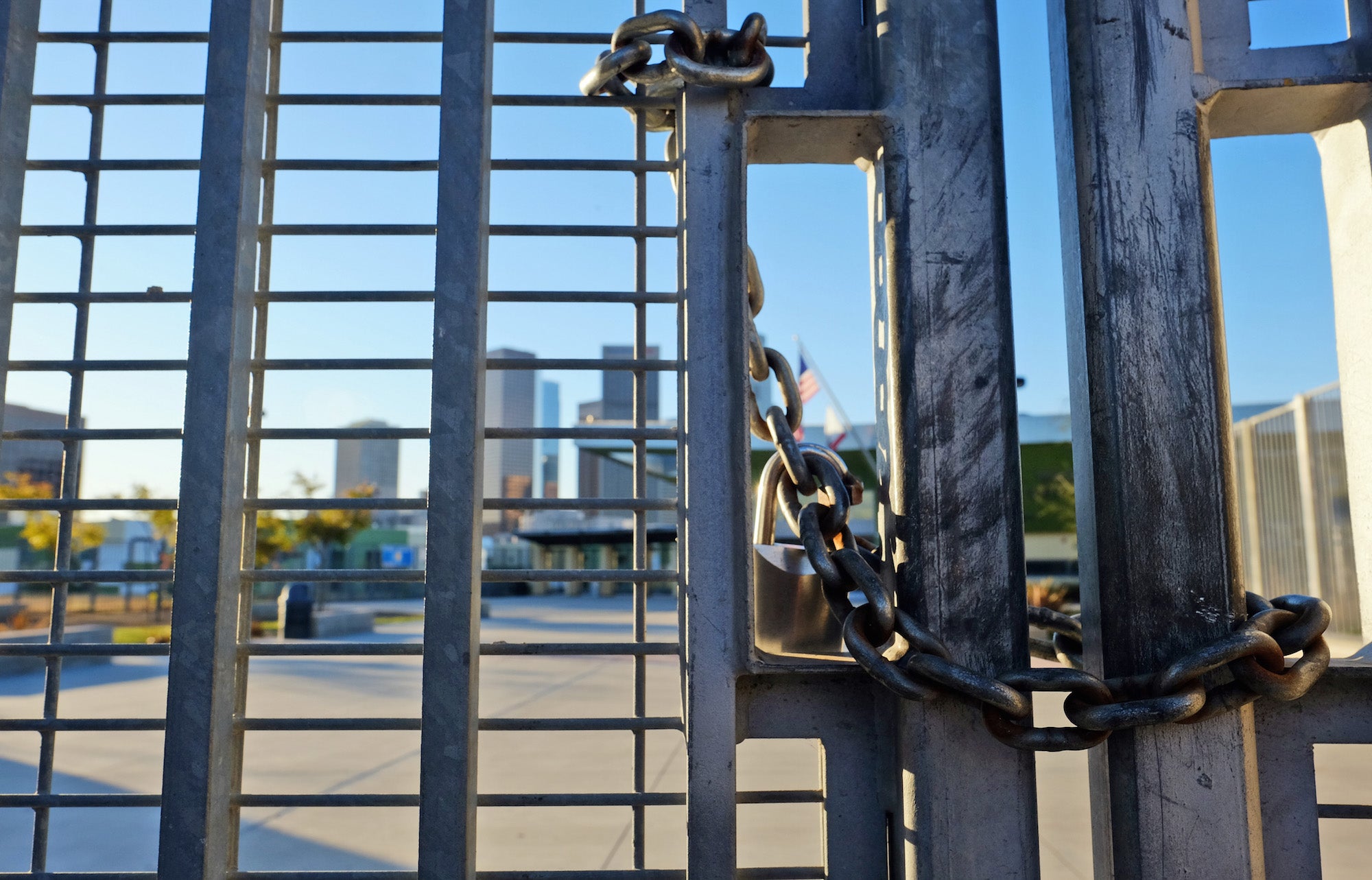 A lock holds the gate shut at Edward Roybal High School in Los Angeles on Tuesday. Associated Press