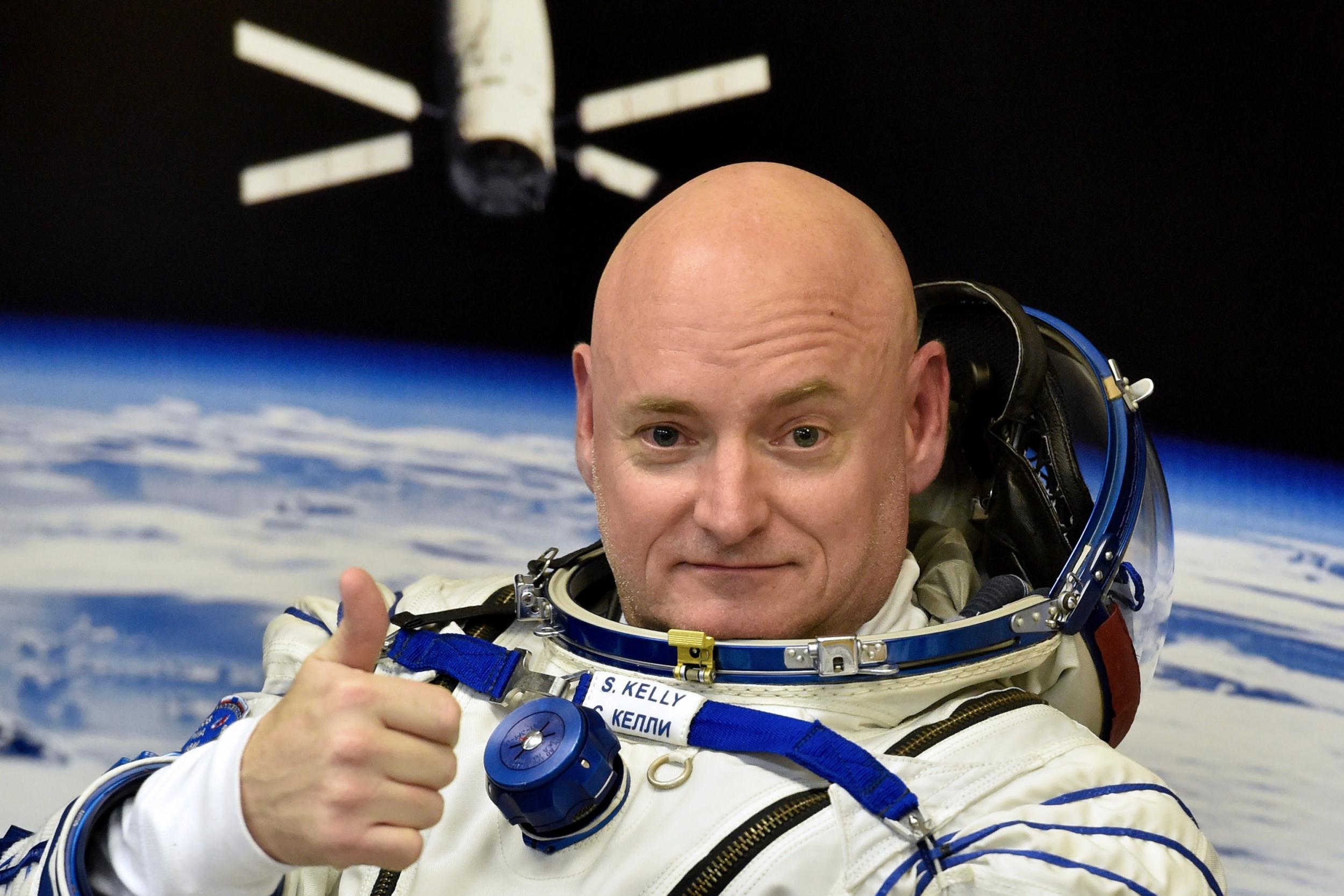 US astronaut Scott Kelly checks his spacesuit at Baikonur Cosmodrome in Kazakhstan